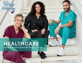 Three healthcare professionals in scrubs on stairs